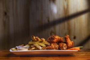 Fried Haven Hot Chicken with a crispy, golden coating and spicy toppings